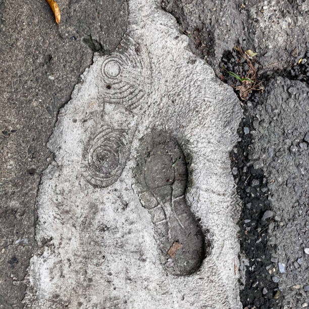 istock Shoe print on dry concrete 1778450680