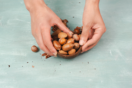 Bowl of nuts, mix variety of almonds, hazelnuts and pecan nuts, healthy food and lifestyle