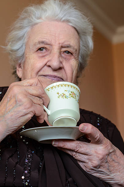 istock senior woman drinking tea/coffee 177845777