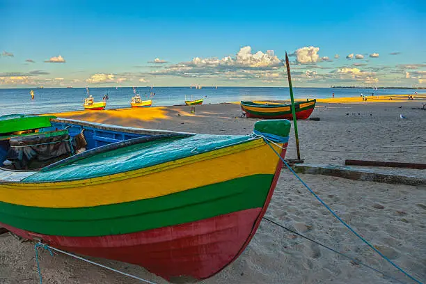 Fishing boats in Sopot with port of Gdansk in the background, Poland.