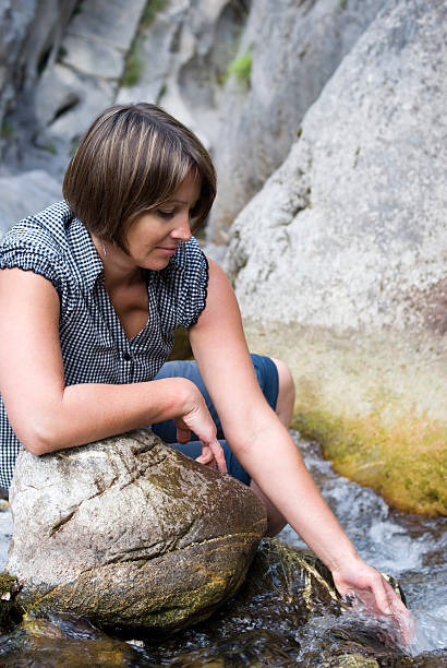 istock Woman by the river 177846451