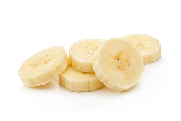 banana slices Banana slices isolated on a white chopped food stock pictures, royalty-free photos & images
