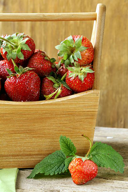 istock ripe organic strawberries with green leaf 177846842