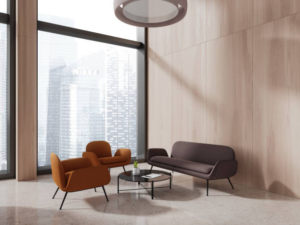 istock Stylish office chill zone interior with couch and armchairs, panoramic window 1778468567