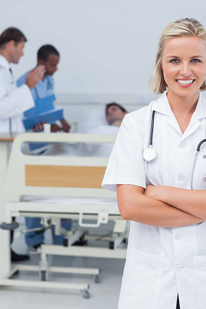 istock Smiling blonde nurse crossing her arms 177847049