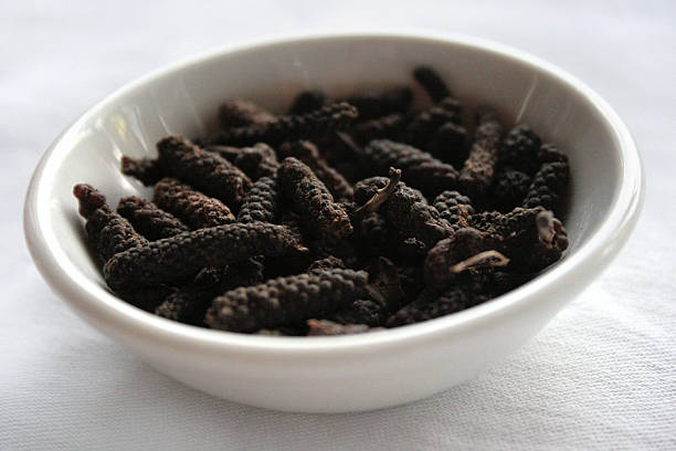 Long pepper (Piper longum) Long pepper is a very rare ingredient in European cuisines, but it can still be found in Indian vegetable pickles, some North African spice mixtures, and in Indonesian and Malaysian cooking capsicum annuum longum stock pictures, royalty-free photos & images