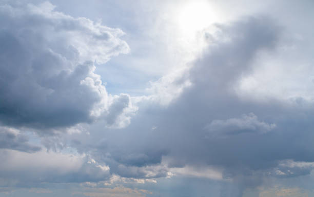 istock White fluffy clouds, sun and blue sky. Majestic view in summer. 1778478478