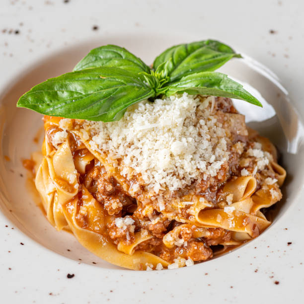 spaghetti bolognese with ragout sauce and parmesan cheese. Healthy food, close-up. Serving food in a restaurant