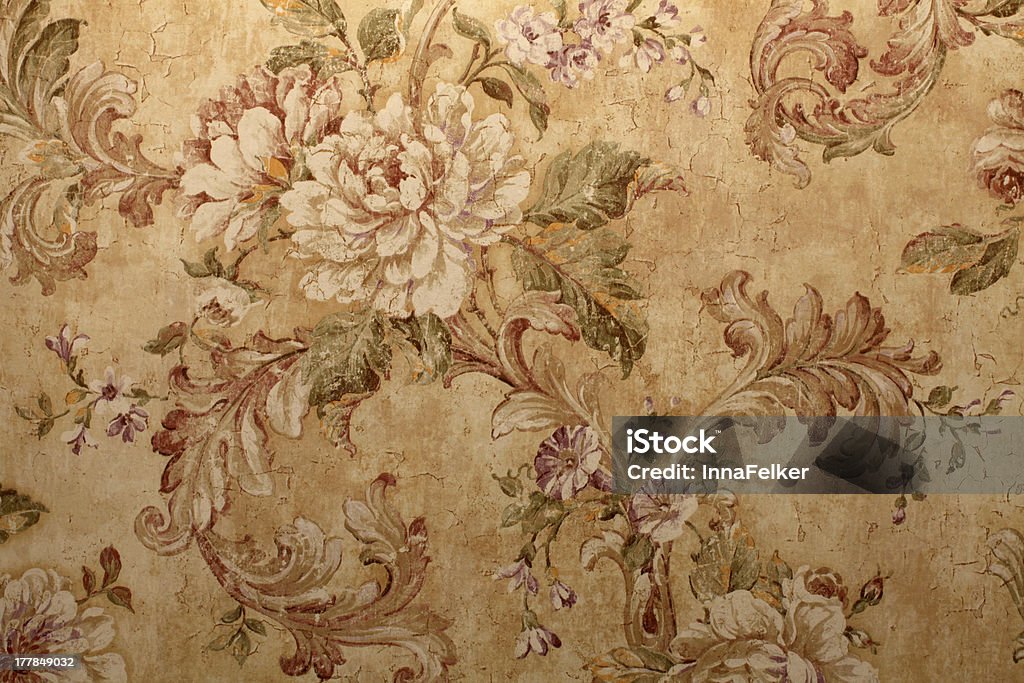 Close-up of beige vintage wallpaper with floral pattern Vintage golden run-down victorian wallpaper with baroque floral pattern Wallpaper - Decor Stock Photo