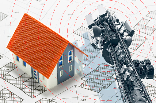 Electromagnetic pollution exposure in a residential area - concept with base radio station for global communications services and electromagnetic emissions fields with cadastral map and building model