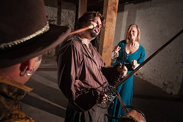 istock Woman Watches Swordsman Get Hit 177849549