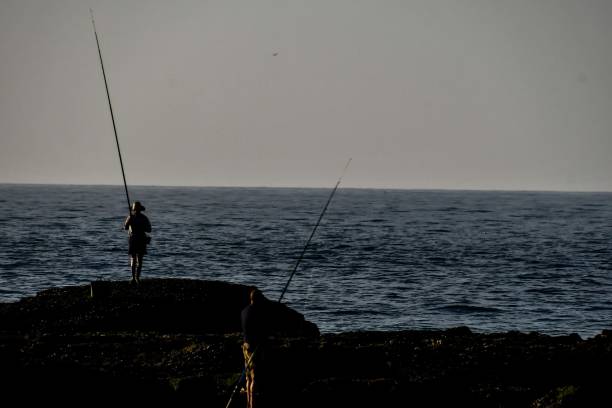 istock fishing at sunset, photo as background 1778497188