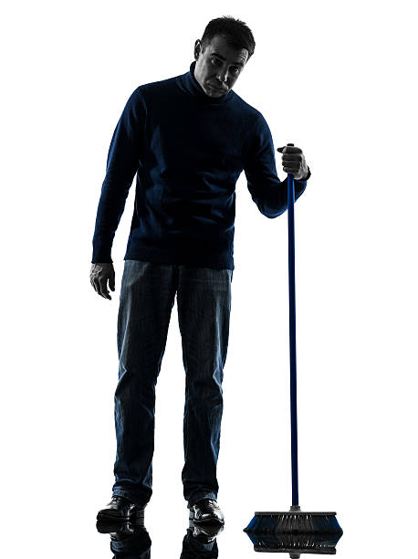 man janitor brooming cleaner boredom silhouette full length one caucasian man janitor brooming cleaner boredom full length in silhouette studio on white background custodian silhouette stock pictures, royalty-free photos & images