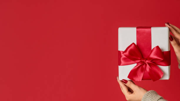 istock Christmas surprise gift delivery female hands box 1778506412