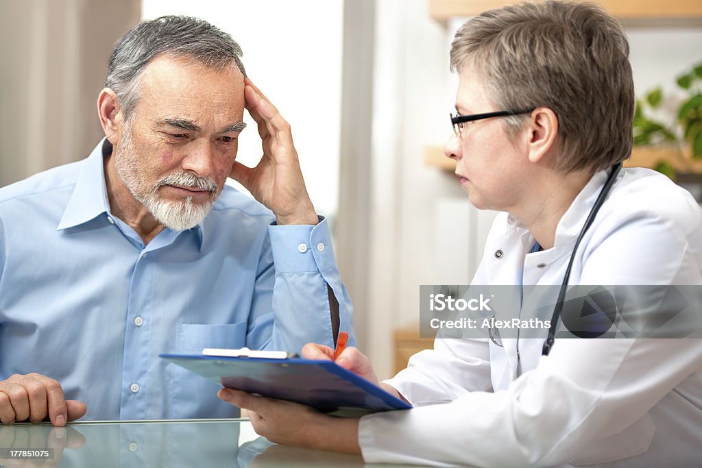 Doctor and patient Male patient tells the doctor about his health complaintsPlease see similar images here: Patient Stock Photo