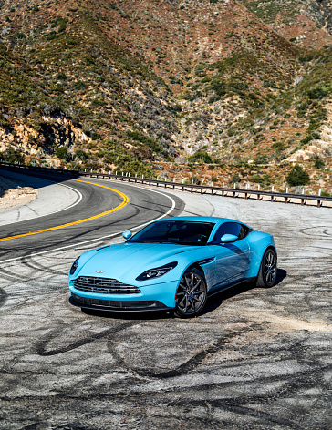 LA, CA, USA
11/5/2023
Aston Martin DB11 in blue showing the car parked on the side of the road