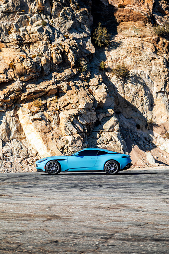 LA, CA, USA
11/5/2023
Aston Martin DB11 in blue showing the with a rock in the background