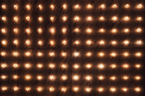 Background of light bulbs on a wall with a place for text