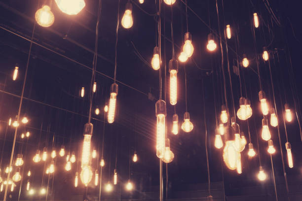 istock Decorative antique edison style filament light bulbs glowing in the dark 1778528617