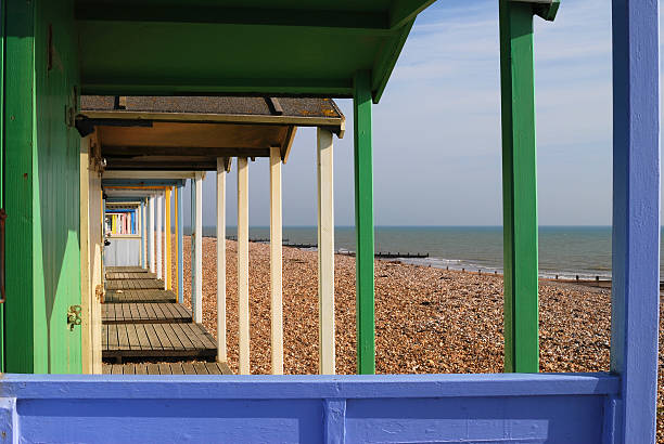 Row of multi-colored beach huts at Rustington. West Sussex. England