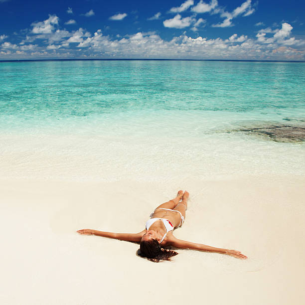istock Cute woman relaxing on the tropical beach 177854561