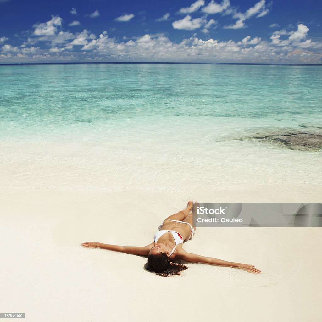 Cute woman relaxing on the tropical beach Adult Stock Photo