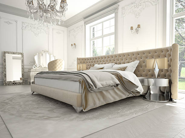 istock Luxurious bedroom featuring chandelier, hotel style bedding 177854582