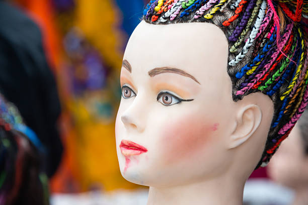 Mannequin head with hair in braids at a booth in an indian market. (XXXLarge)
