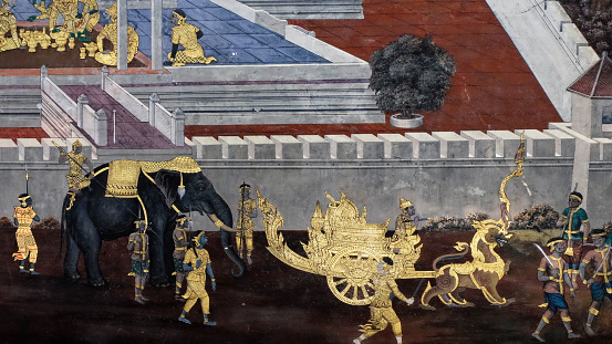 Bangkok, Thailand, December 27, 2018. A Bangkok temple features a traditional Thai mural that recounts mythical narratives from the Ramayana.