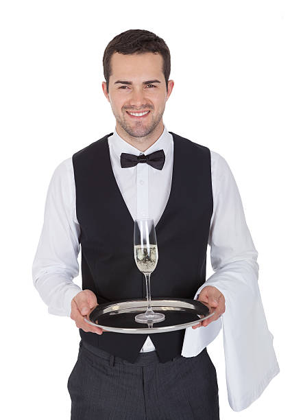 retrato de un joven alegre de mayordomo - waiter butler champagne tray fotografías e imágenes de stock
