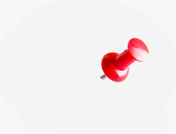 istock close up of a pushpin on white background 177856321