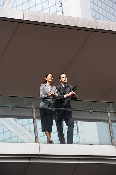 istock Two Business Colleagues Having Discussion Outside Office Buildin 177857857