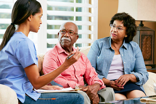 istock Nurse Making Notes During Home Visit With Senior Couple 177858209