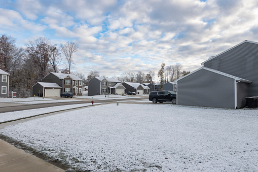 Photo of a street at a residential suburban city on winter, Caledonia, Michigan, USA