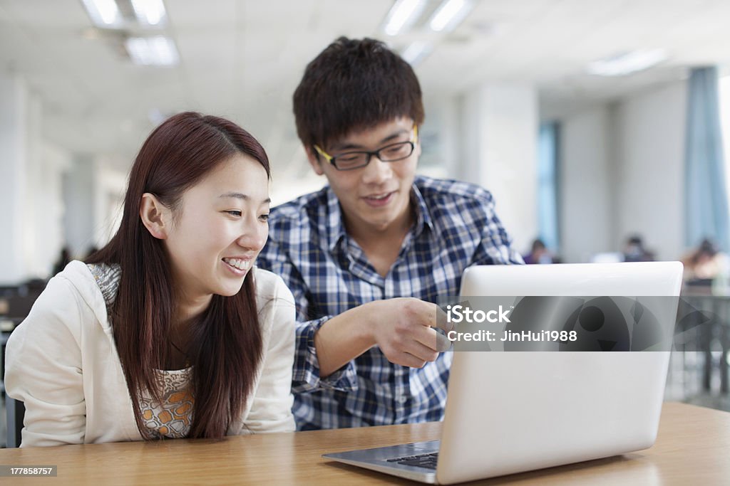 student Two students in the library computer learning 20-24 Years Stock Photo