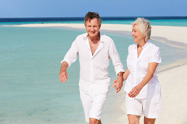 istock Senior Romantic Couple Walking On Beautiful Tropical Beach 177859366