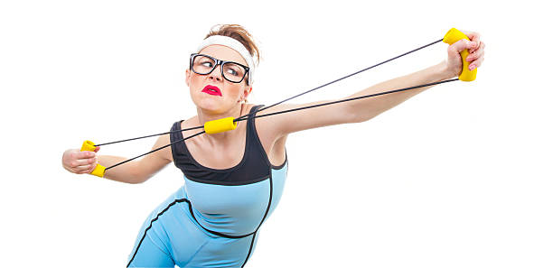 Young woman standing in circle for throwing knives.