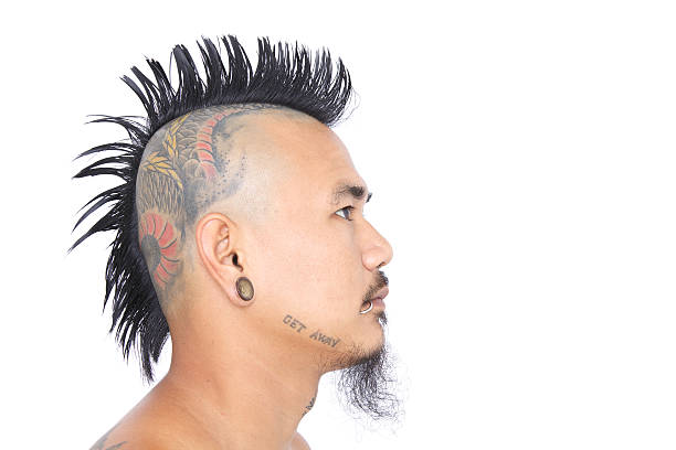 istock punk with mohawk hair style, tattoo on head, ear piercing 177860537