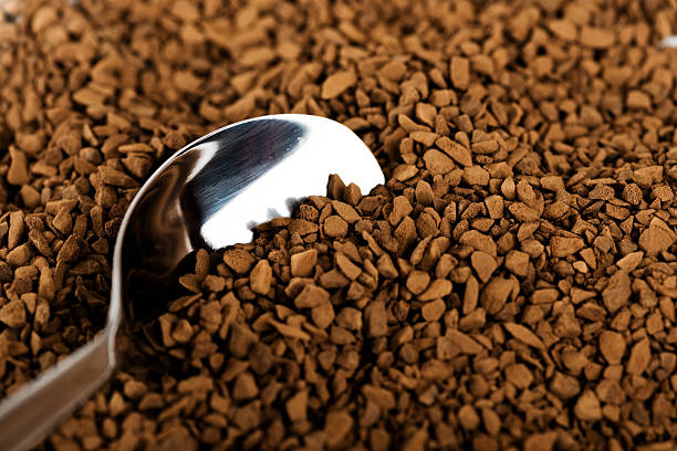 Spoon of coffee at coffe background stock photo