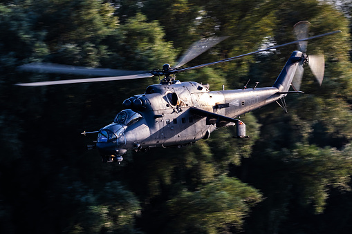 Szolnok, Hungary - August 18, 2022: Hungarian Air Force Mil Mi-24 Hind military attack helicopter. Flight operation. Aviation industry and rotorcraft. Transport and airlift. Fly and flying.