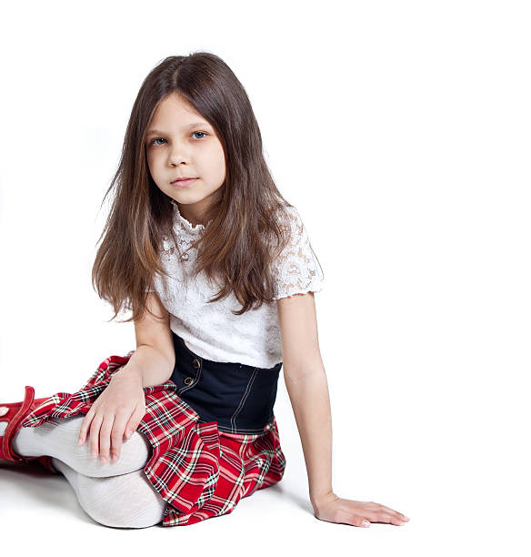 istock Little girl in school uniform isolated on white background 177862248