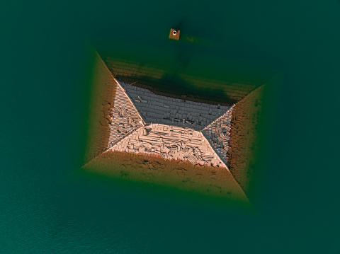 Aerial view of sunken house by dam waters. Taken via drone. Isparta, Türkiye.