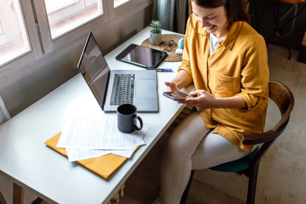 istock Woman using smartphone in the office 1778630155