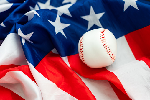 Baseball and the American flag background sports concept. High quality photo