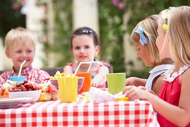 istock Group Of Children Enjoying Tea Party 177864689