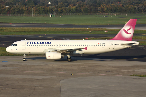 Düsseldorf, Germany - October 2, 2011: Turkish Freebird Airlines Airbus A320-200 with registration TC-FBR on taxiway at Düsseldorf Airport.