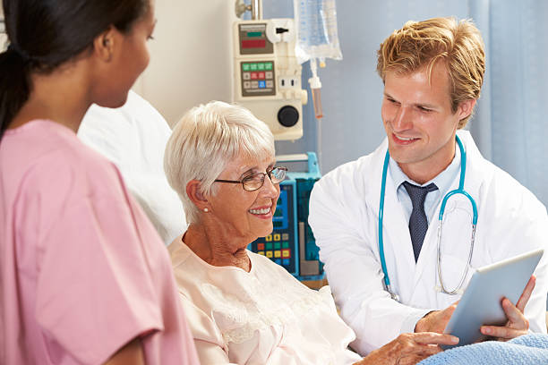 istock Doctor Using Digital Tablet In Consultation With Senior Female Patient 177865341
