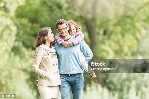 Happy Family Of Three Having Fun Outdoor Stock Photo - Download Image Now - Adult, Autumn, Beautiful People