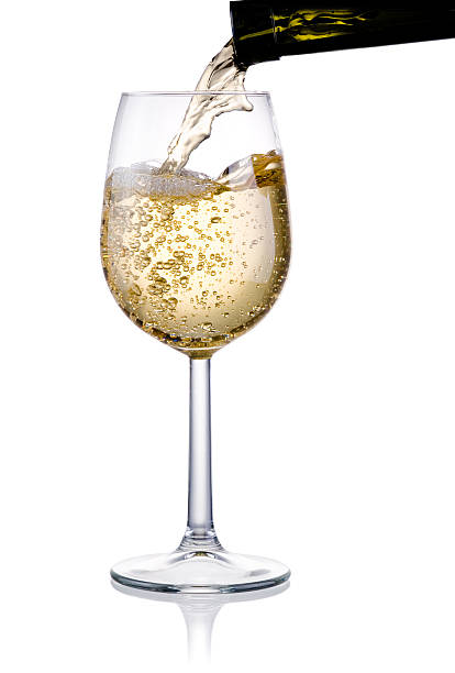 verter de una copa de vino blanco aislado - wine pouring wineglass white wine fotografías e imágenes de stock