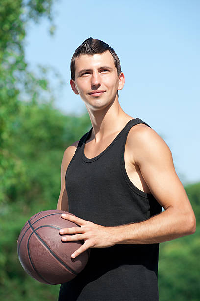 istock Young basketball player with ball 177866388